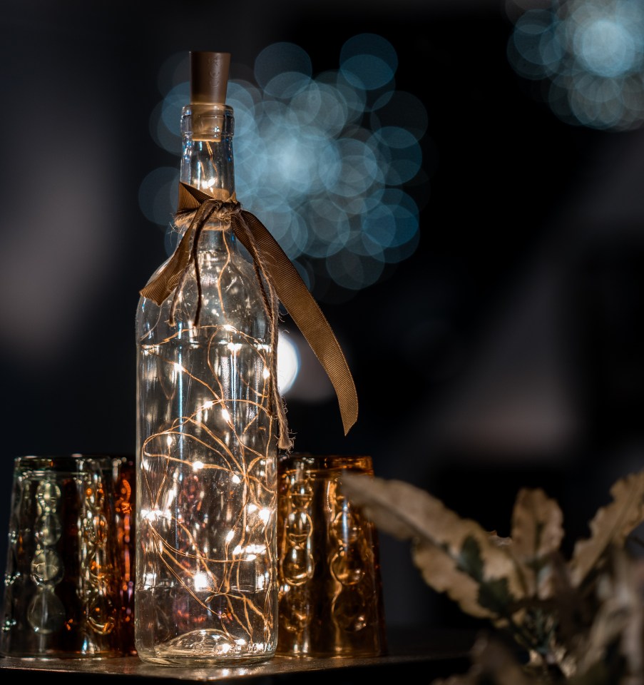 Glass bottle with fairy lights inside.