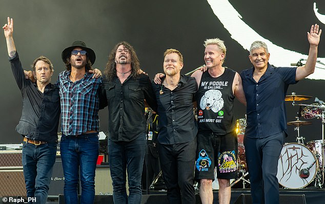 The Foo Fighters have fired a key band member in a shock decision eight months after Dave Grohl's affair rocked the group - pictured Chris Shiflett, Rami Jaffee, Dave Grohl, Nate Mendel, Josh Freese and Pat Smear at Glastonbury in 2023
