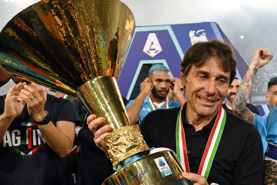 Antonio Conte of Napoli holding the Serie A trophy.