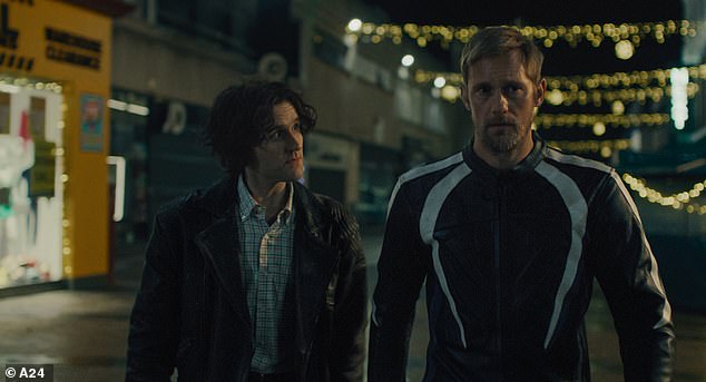 Former Harry Potter actor Harry Melling stars in X-rated film Pillion that earned an incredible eight-minute standing ovation at Cannes Film Festival on Sunday night (seen in the film with co-star Alexander Skarsgård)