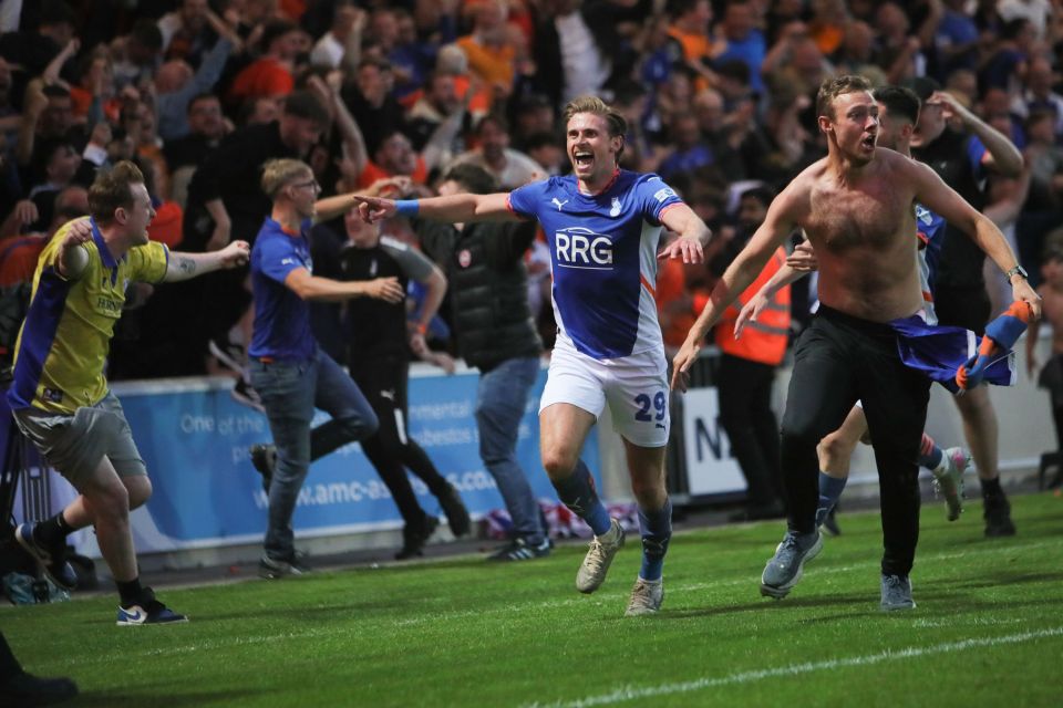 Oldham Athletic player celebrating a goal.