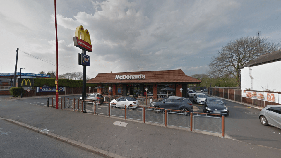 McDonald's restaurant with cars in the drive-thru.