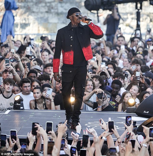 French rapper Werenoi (pictured in July 2024) has reportedly died of a cardiac arrest at the age of 31 just hours before he was due on stage