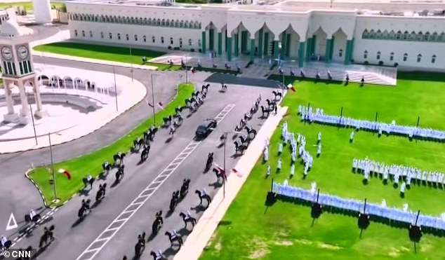 Arabian horses walk alongside President Donald Trump's limousine as he arrived Wednesday to the Amiri Diwan, the official administrative offices of the Emir, which started out as an 18th Century fort