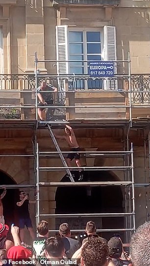 One fan had attempted to climb up scaffolding to get on the balcony of an overlooking flat