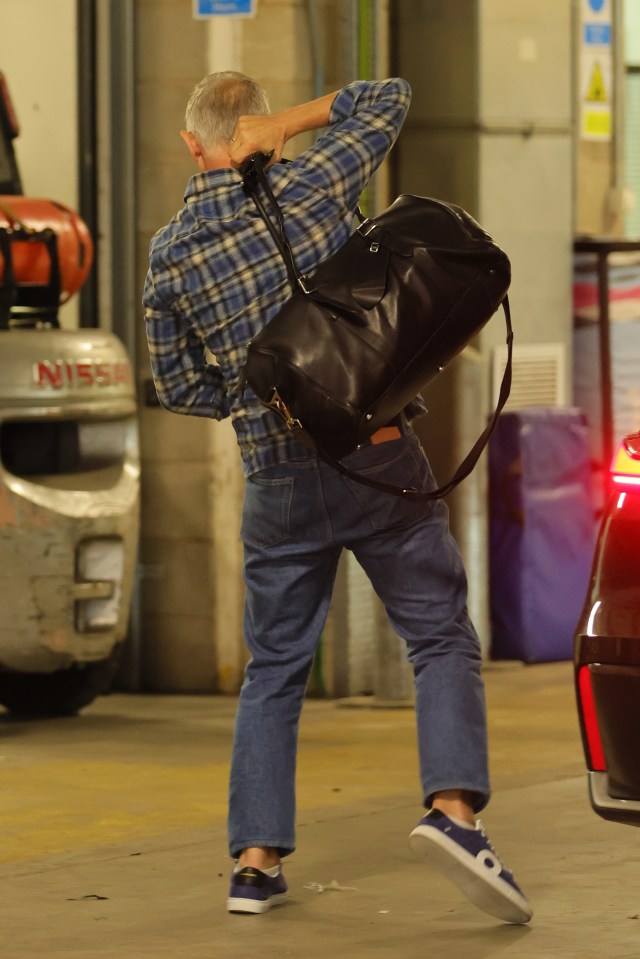 Gary Lineker carrying a bag.