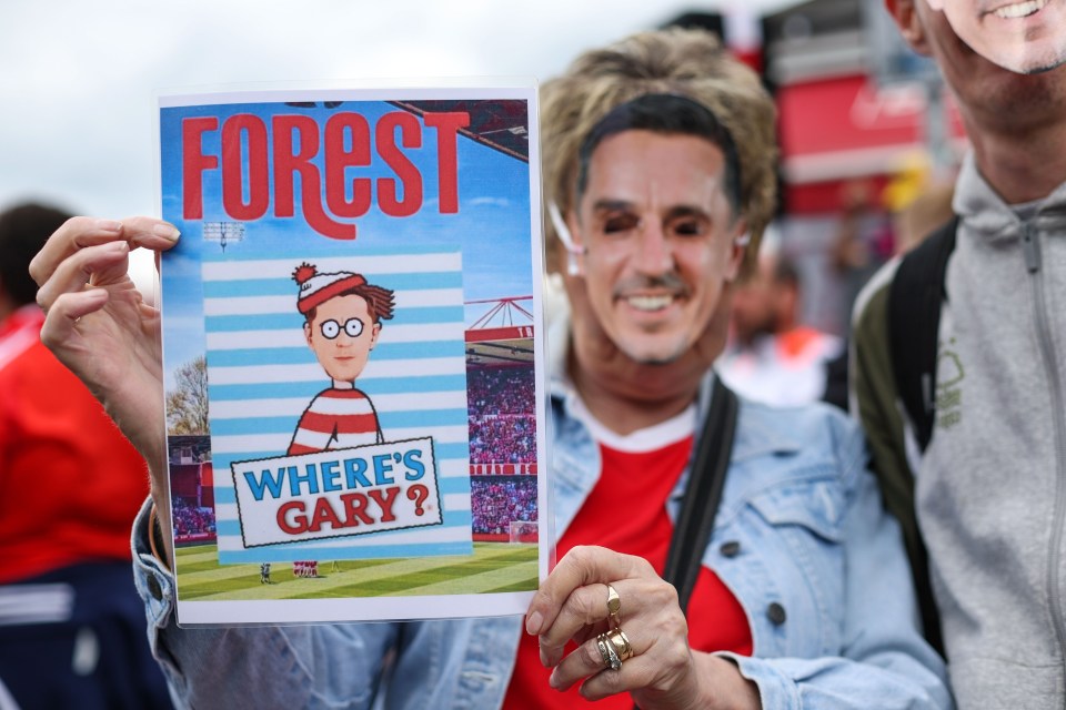 A Nottingham Forest fan holding a sign that parodies "Where's Wally?" but asks "Where's Gary?"  The fan is wearing a Gary Neville mask.