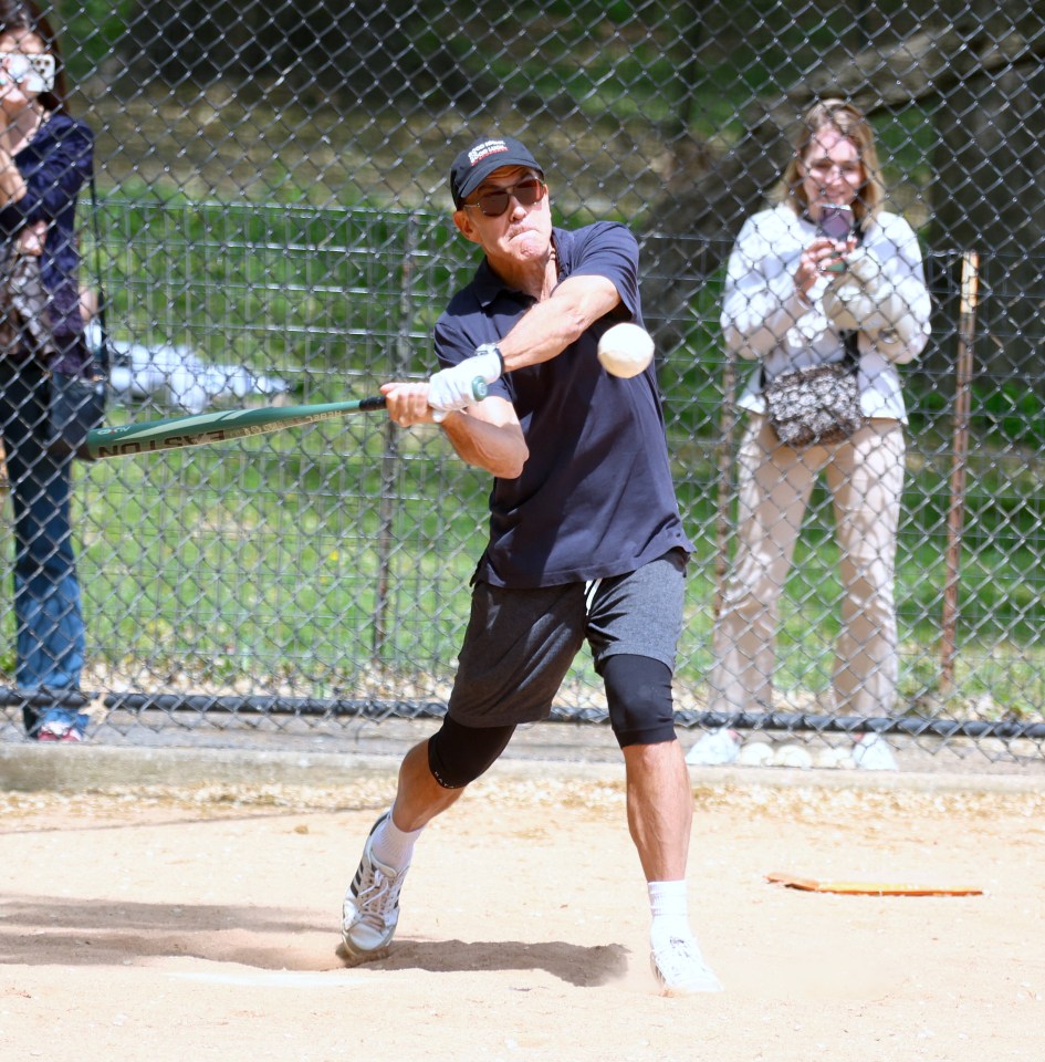 George Clooney playing baseball in Central Park.