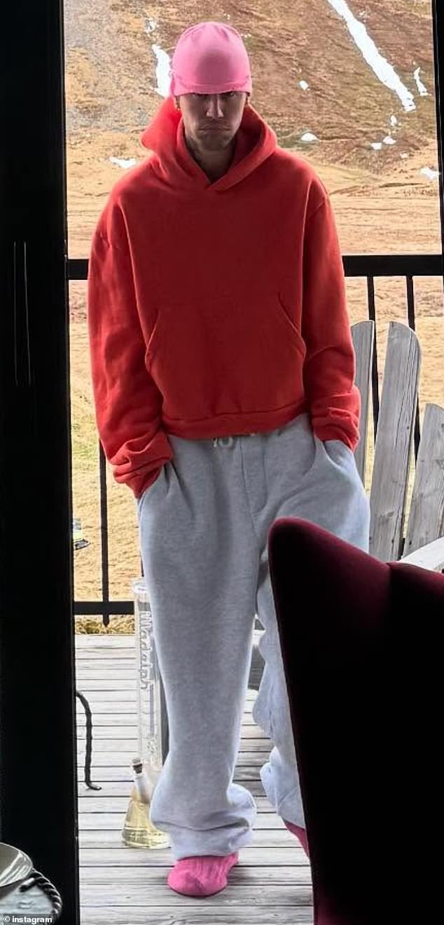 Another photo saw him on a patio with a picturesque mountain view behind him as well as what seemed to be a bong on the floor behind him