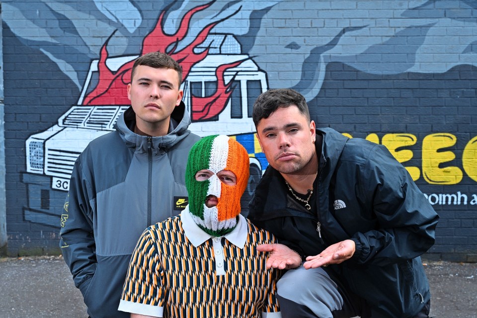 Portrait of three members of Irish rap group Kneecap.