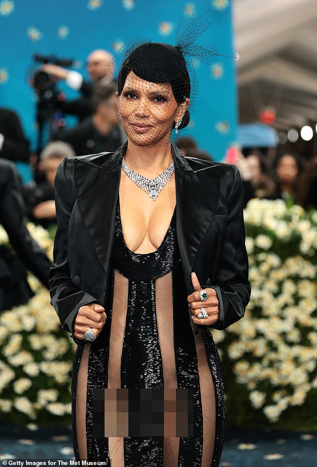 The 58-year-old Oscar-winning actress modeled a plunging, beaded black and sheer striped LaQuan Smith gown - but risked a major wardrobe malfunction every time she moved due to her lack of lingerie