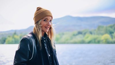 Helen Skelton by a lake.