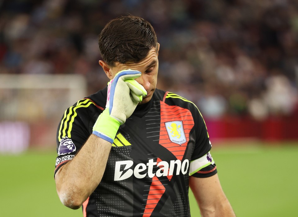 Emiliano Martinez of Aston Villa wiping away tears after a game.