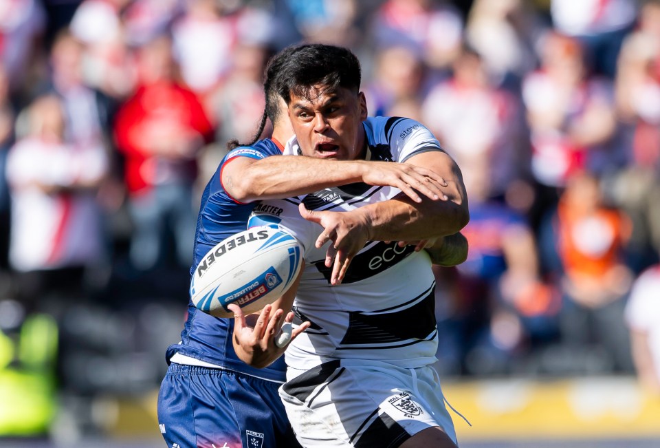 Rugby player tackled during a match.