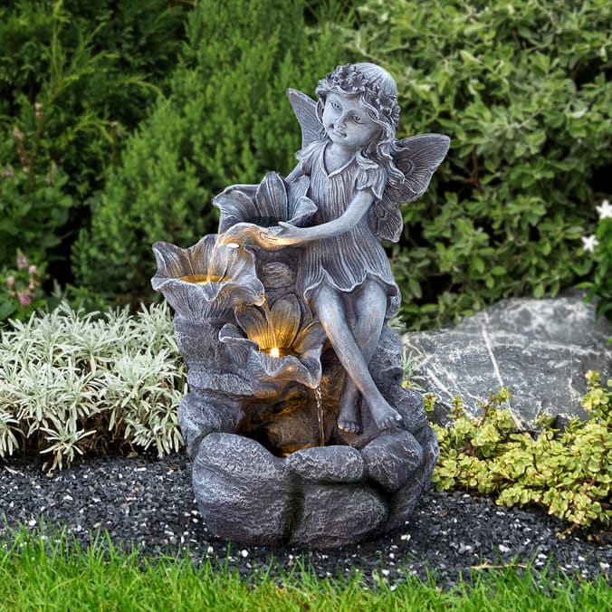 Fairy water feature garden statue.