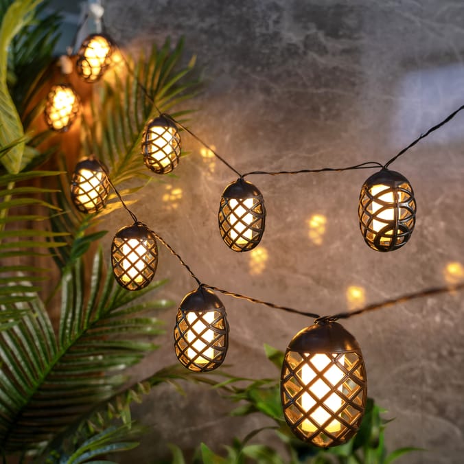 Solar-powered string lights with lantern-shaped shades.