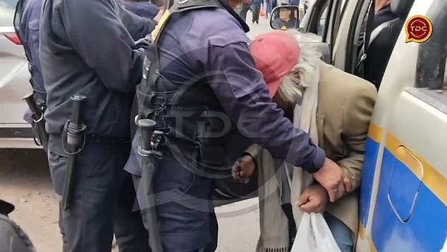 Video showed the elderly man being put into a police vehicle before he was taken to the home