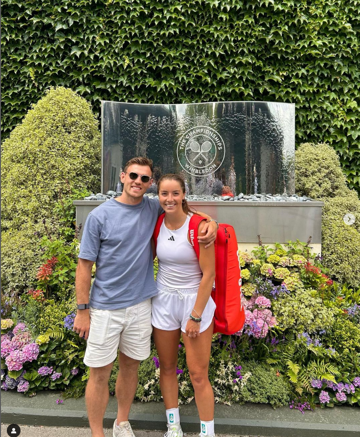 Couple posing at Wimbledon.