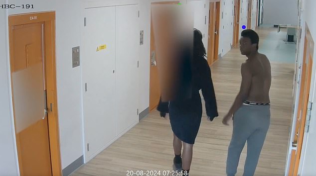 Ashirie Smith (right), 19, and Thierry Robinson (left), 21, are seen walking down the corridor before entering the cell belonging to Mahir Abdulrahman, 31