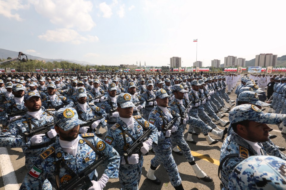 Iranian soldiers marching in a military parade.