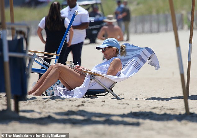 Jill Biden reads on the beach in Rehoboth, Del., where the Biden family has a vacation home