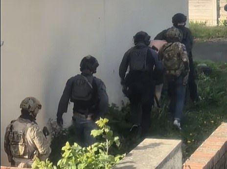 It's believed the officers in black uniforms are specialists from counter-terrorism police. They are thought to have been supported by members of the SAS