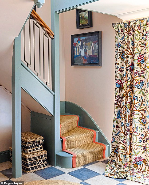 The stairs are painted in Green Smoke (farrow-ball.com) to give the entrance hall a heritage vibe. The curtains are antique crewel and were found in a vintage shop outside Rye for £80.