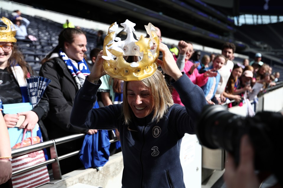 Chelsea manager Sonia Bompastor celebrates with an inflatable crown.