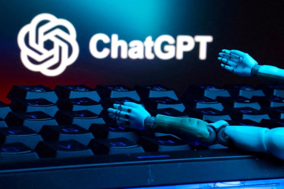 Illustration of robot hands on a keyboard in front of a ChatGPT logo.