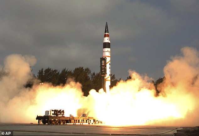 India's Agni-V missile, with a range of 5,000 kilometers (3,100 miles), lifts off from the launch pad at Wheeler Island off India's east coast