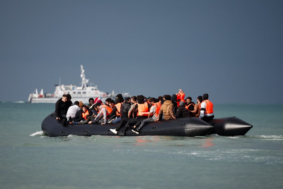 Migrants in an inflatable dinghy crossing the English Channel.