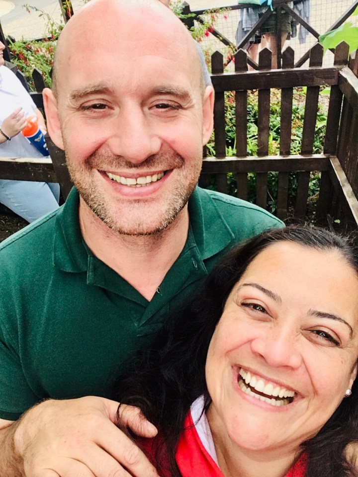 Couple smiling for a selfie.