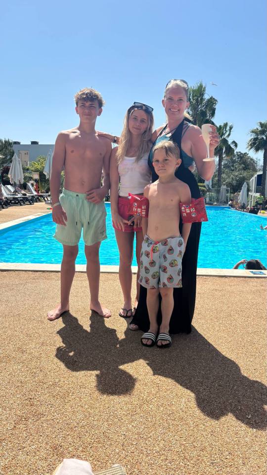 Family by a swimming pool.