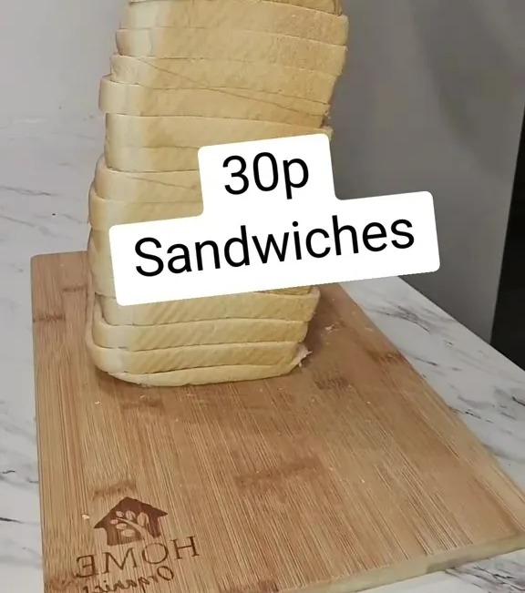 A stack of bread slices on a cutting board; text overlay reads "30p Sandwiches" and "Check out the caption for what you shouldn't put on your sandwich".