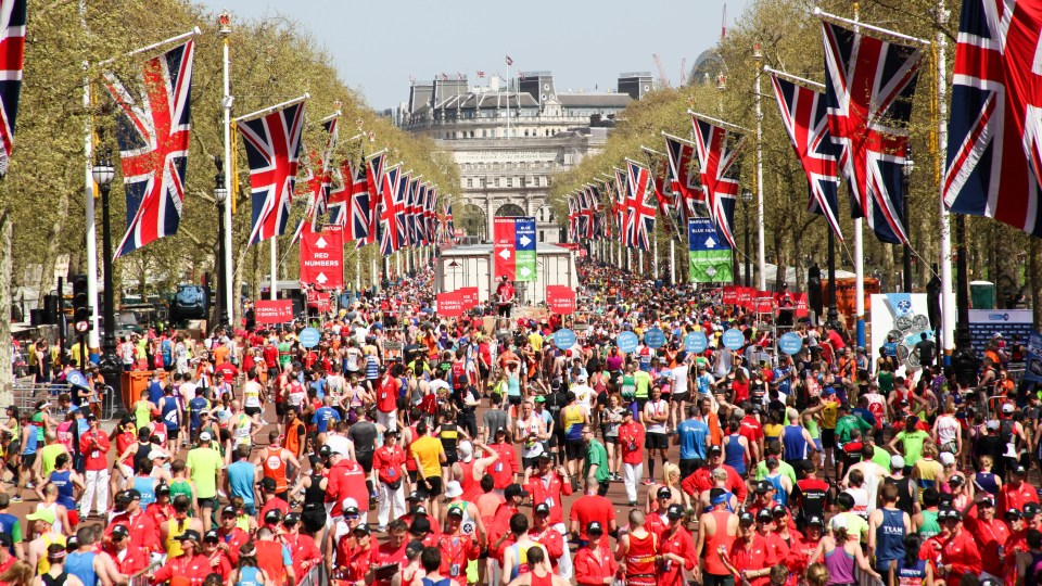 Marathon runners crossing the finish line in London.