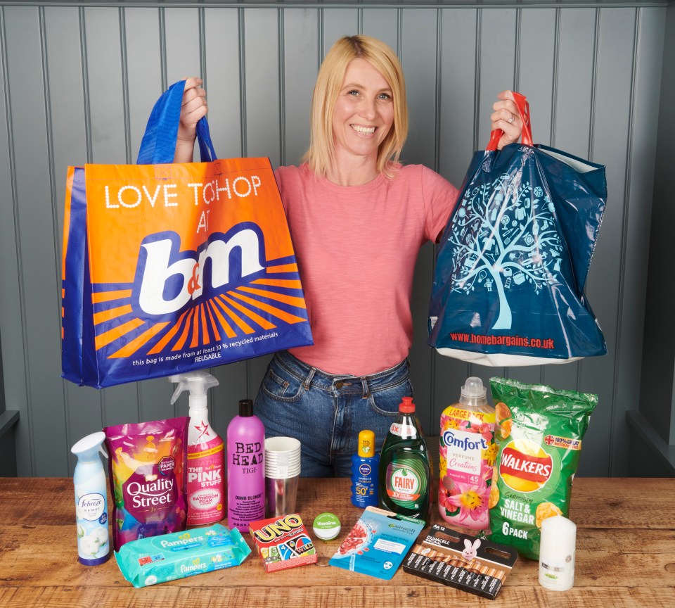 Woman holding shopping bags from B&M and Home Bargains, with various household items on a table.