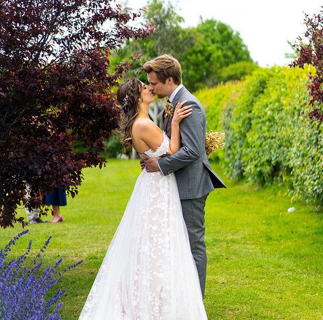 Sophie and Jack Moody, both 31, on their wedding day where Jack announced he was taking his new wife's name