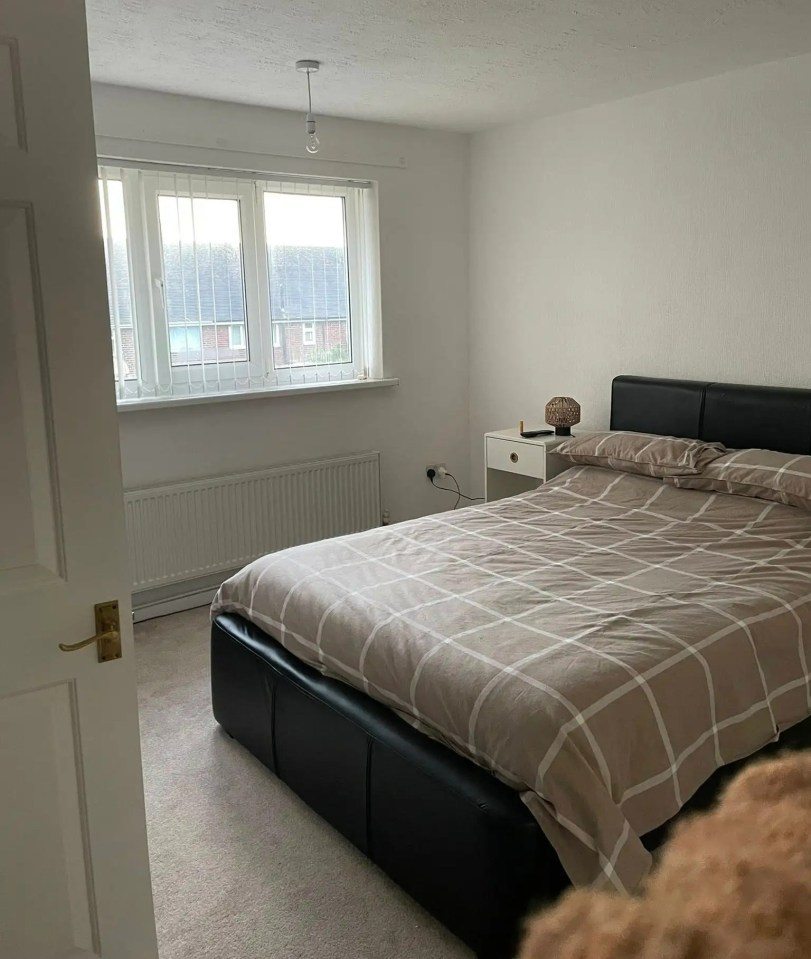 Bedroom with double bed and window.