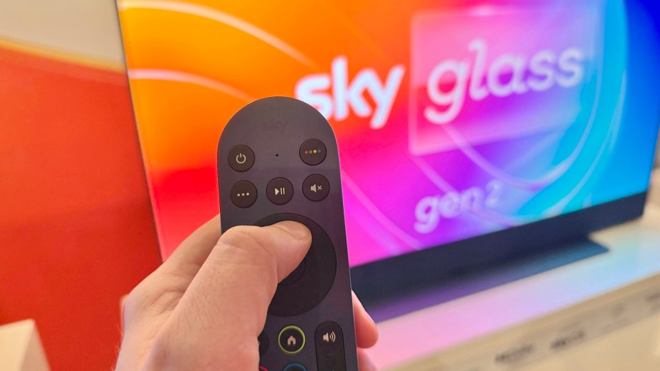 Hand holding Sky Glass Gen 2 remote.