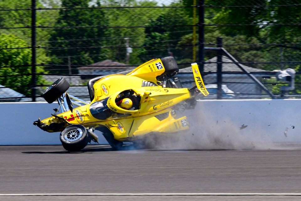 Race car crashing into a wall.