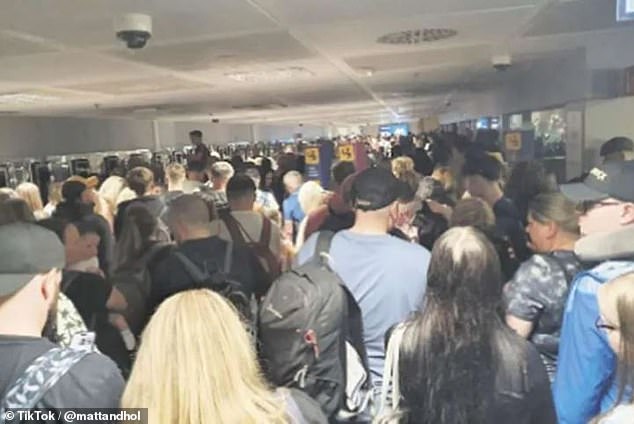 Airport chaos forced British families to 'lift children onto their shoulders to stop them suffocating' as they were trapped in an overcrowded passport control in Tenerife