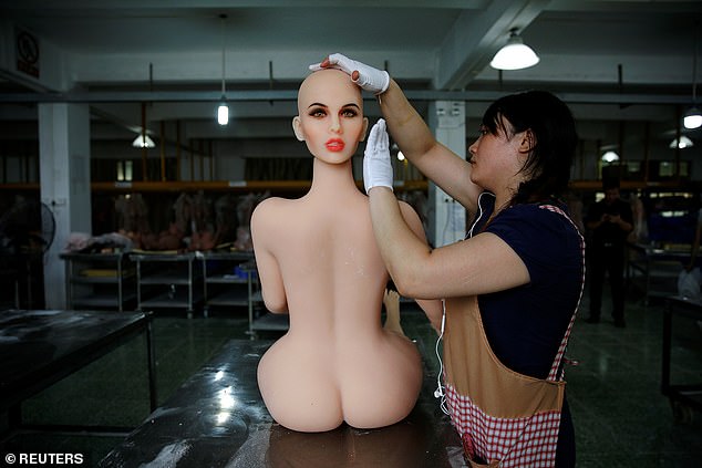 A worker assembles a sex doll at the WMDOLL factory in Zhongshan, Guangdong Province, China