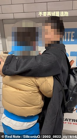 After racing through Tottenham Court Road, the Chinese appears to grip the alleged thief in a bear hug in a bid to stop him racing away