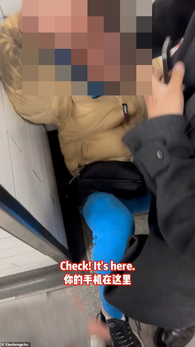 Shocking video footage appears to show an alleged thief snatch a phone out of the hands of an unassuming Chinese student