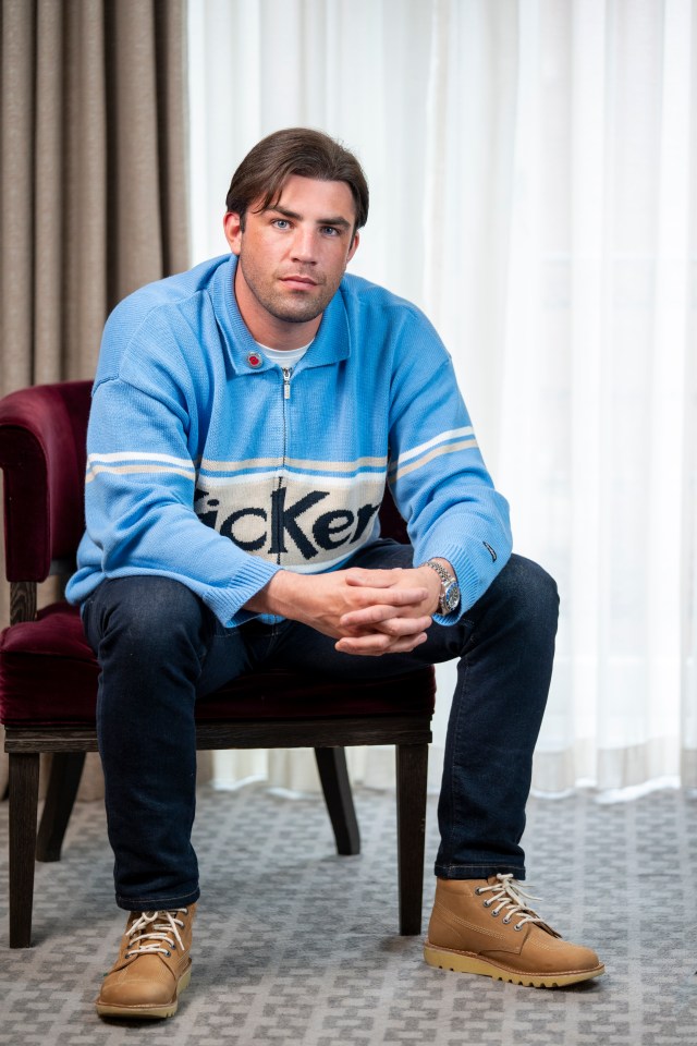 Jack Fincham sits in a chair and discusses his bulimia.