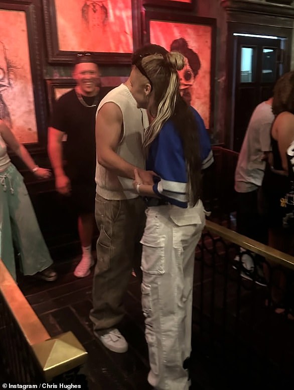 JoJo Siwa and Chris Hughes have finally confirmed their romance, with the pair seen sharing a kissing during their break to Florida
