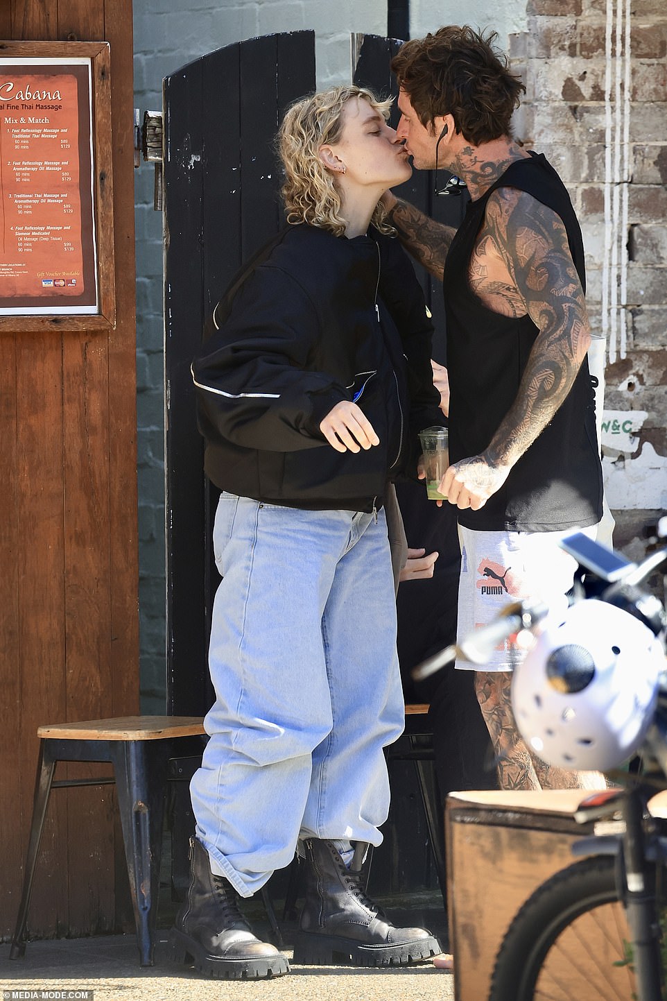 JoJo Siwa's ex Kath Ebbs has been seen for the first time since returning to Australia after being brutally dumped at the Celebrity Big Brother afterparty, kissing a male friend on the lips during an outing in Bondi on Sunday