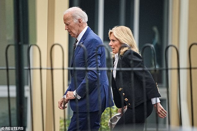 Former President Joe Biden, with his wife Jill Biden, walks to St. Joseph on the Brandywine Catholic Church for services marking the anniversary of the death of Beau Biden