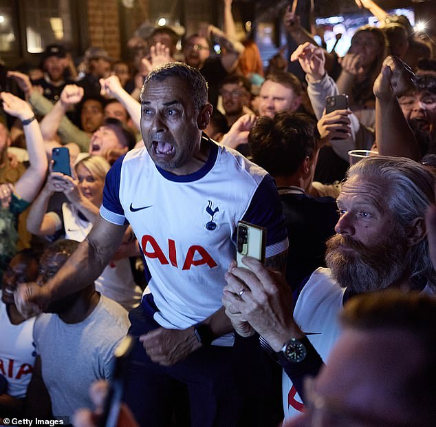 Spurs fans celebrate at full time in the Beehive Pub, Tottenham as Tottenham Hotspur win the Europa Cup after defeating Manchester United 1-0