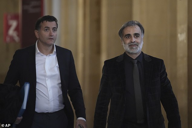 Abderrahmane Ouatiki, right, who was working as a hotel receptionist, arrives for the verdict in the Kim Kadashian heist during the Paris Fashion Week in 2016, Friday, May 23, 2025